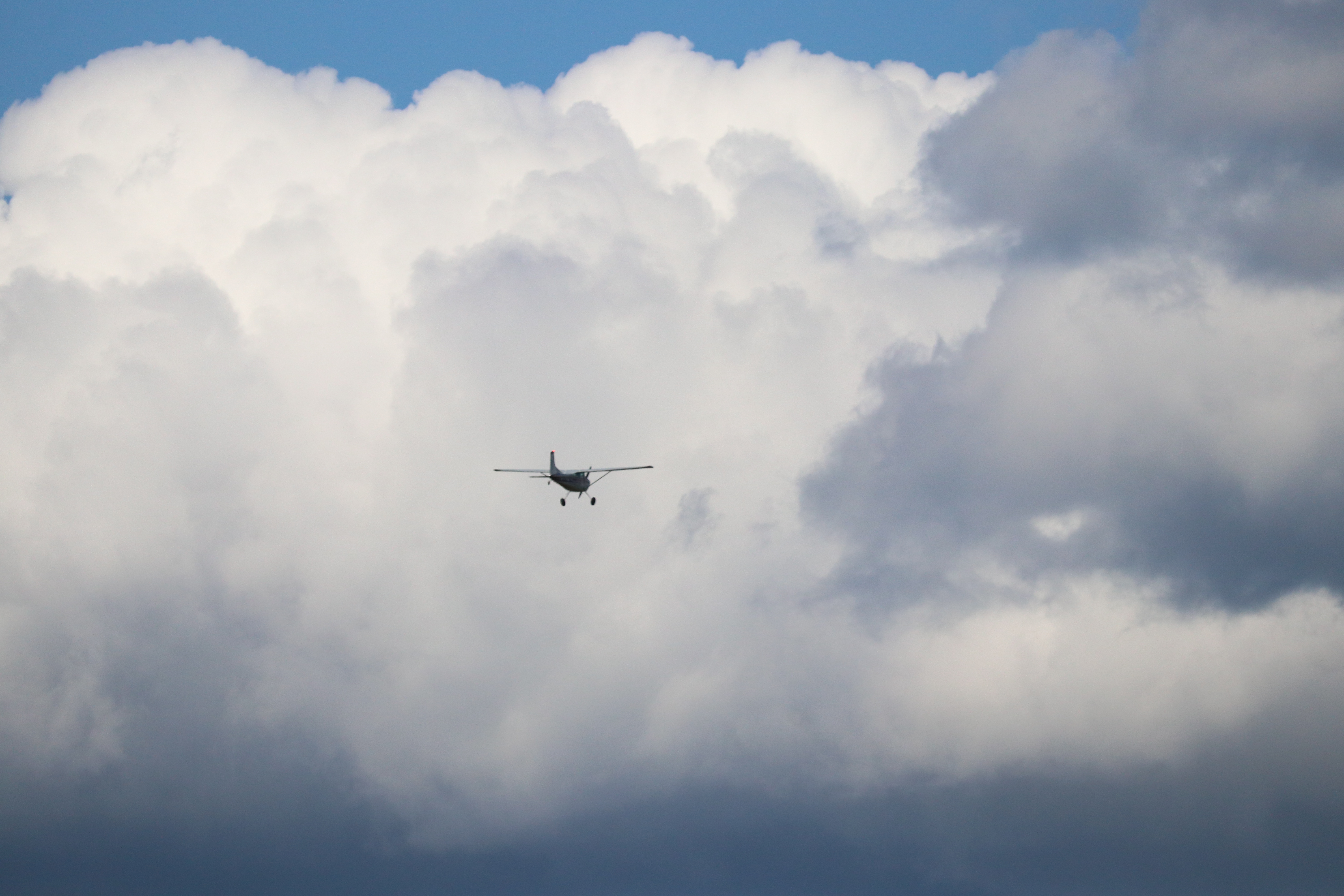 airplane flying into clouds